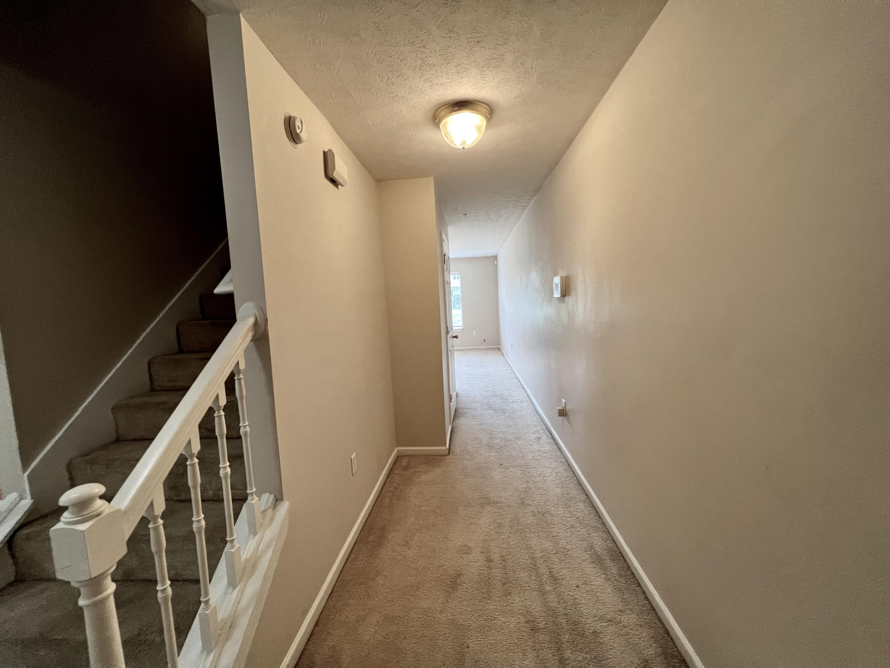 308 Crooked Pine Trail Crestview, FL 32539 - Photo 8 of 20 a view of a hallway with wooden floor and entryway
