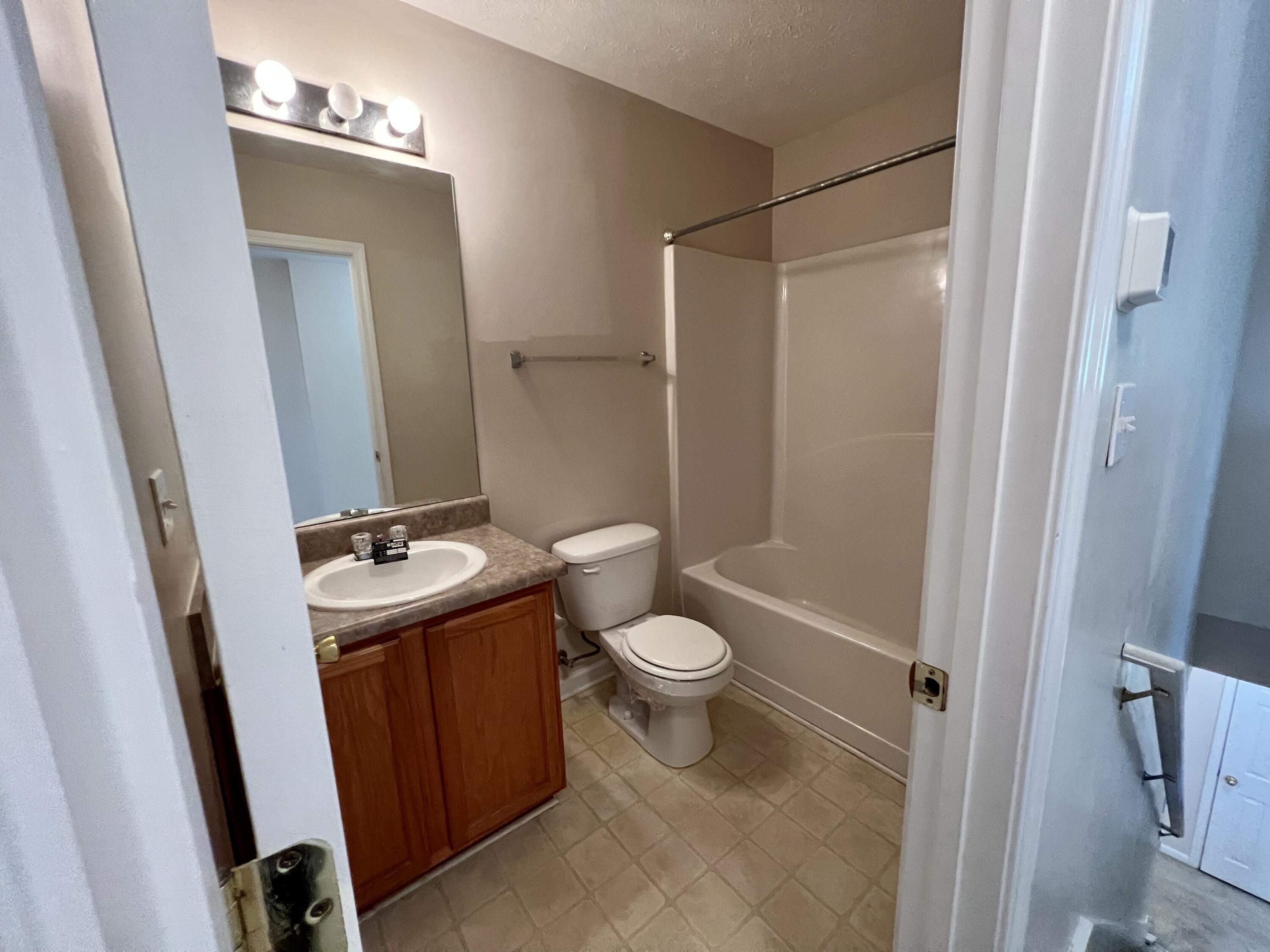 308 Crooked Pine Trail Crestview, FL 32539 - Photo 9 of 20 a bathroom with a sink a toilet a mirror and shower