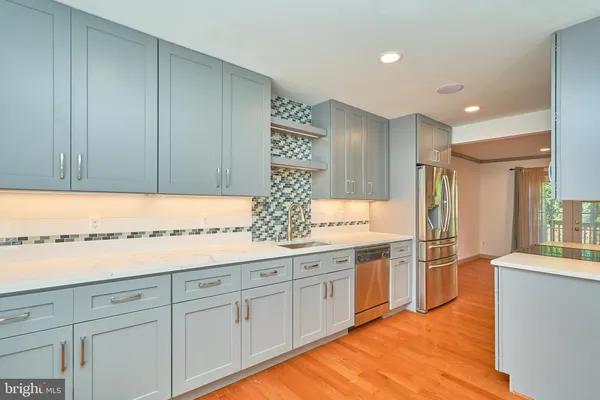 a kitchen with a sink and cabinets