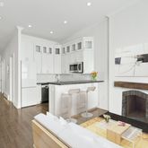 a view of living room with granite countertop furniture and fireplace