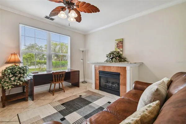 a living room with furniture and a fireplace