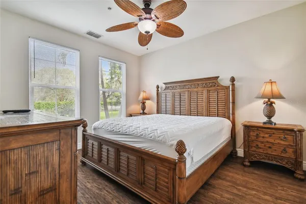 a bed sitting in a bedroom next to a window