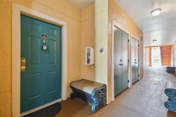 a view of a hallway with bathroom