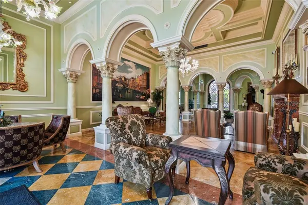 a view of living room filled with furniture and wooden floor