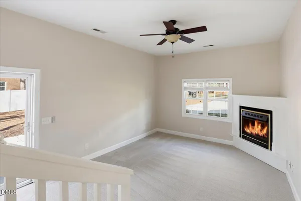 a kitchen with stainless steel appliances granite countertop a stove top oven a sink dishwasher a dining table and chairs with wooden floor