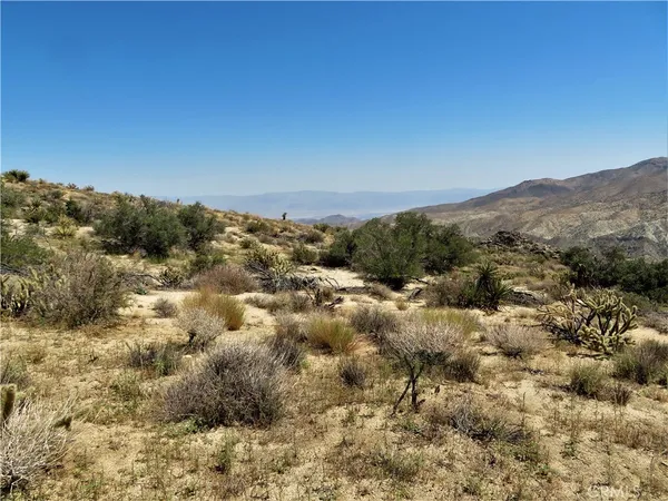 a view of a city with mountains in the background