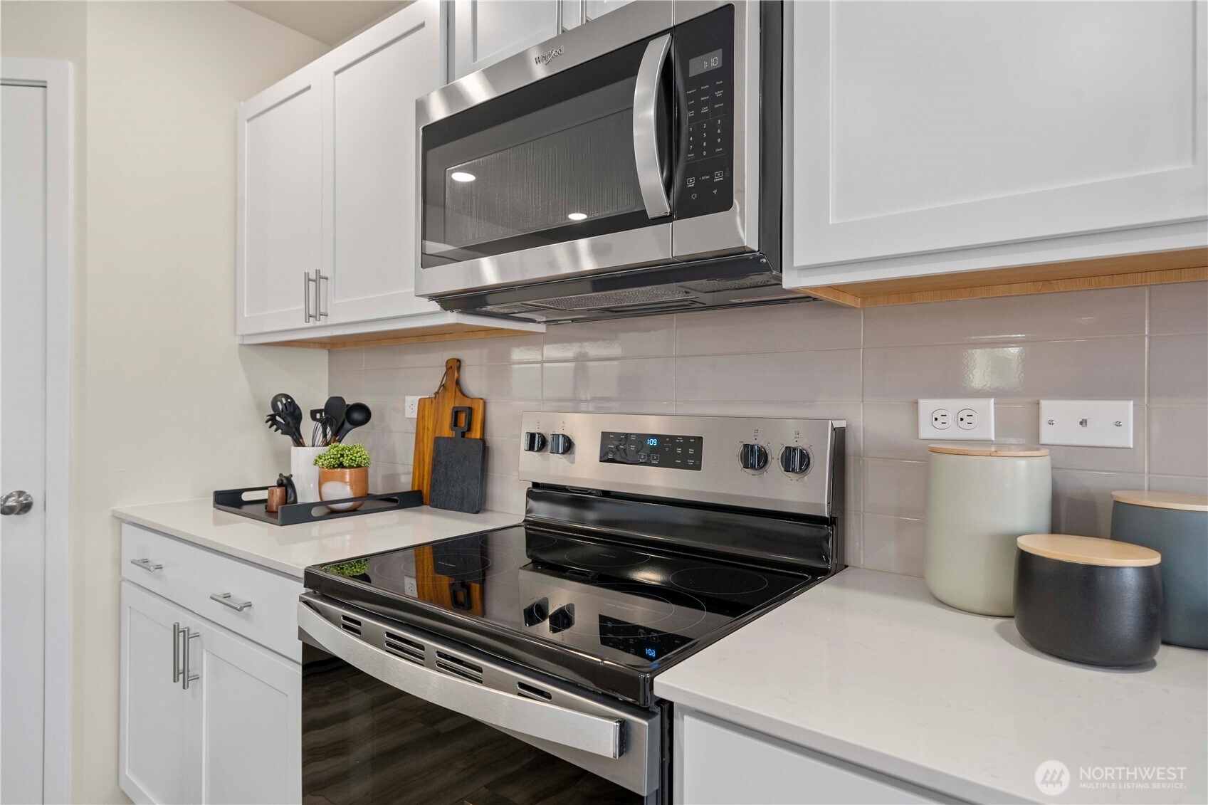 13430 323rd Avenue Southeast Sultan, WA 98294 - Photo 18 of 36 a kitchen with a stove and a microwave
