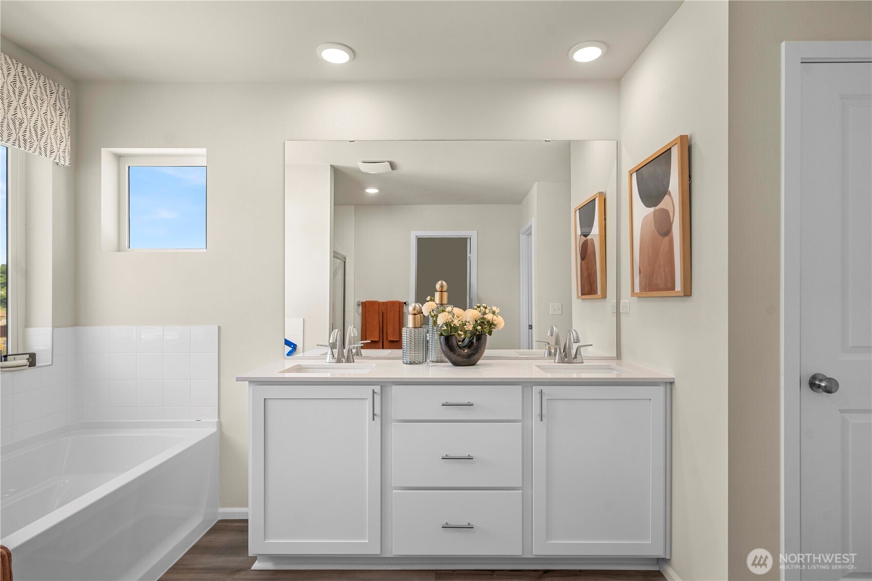 13430 323rd Avenue Southeast Sultan, WA 98294 - Photo 32 of 36 a bathroom with a double vanity sink and mirror with bathtub