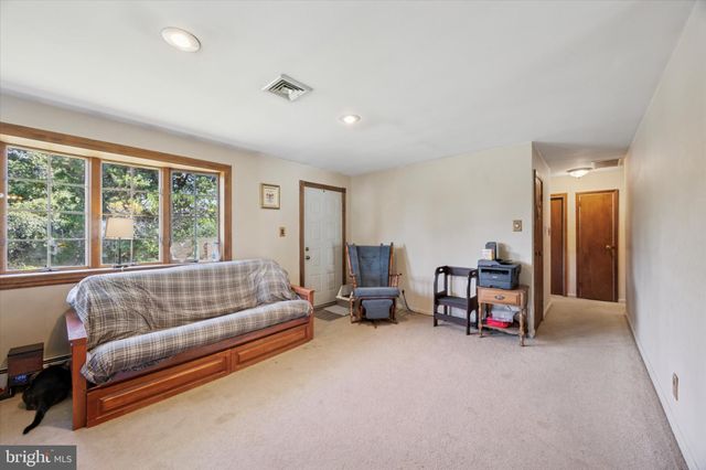 a bed room with furniture and a window