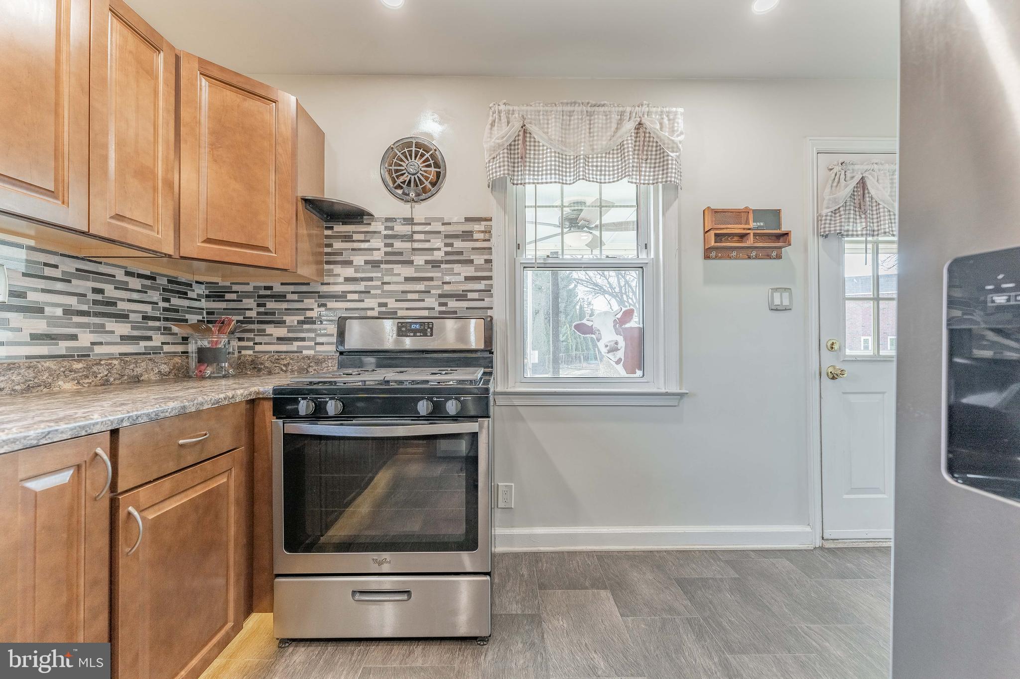 501 W Road Ridley Park, PA 19078 - Photo 11 of 29 a stove top oven sitting inside of a kitchen