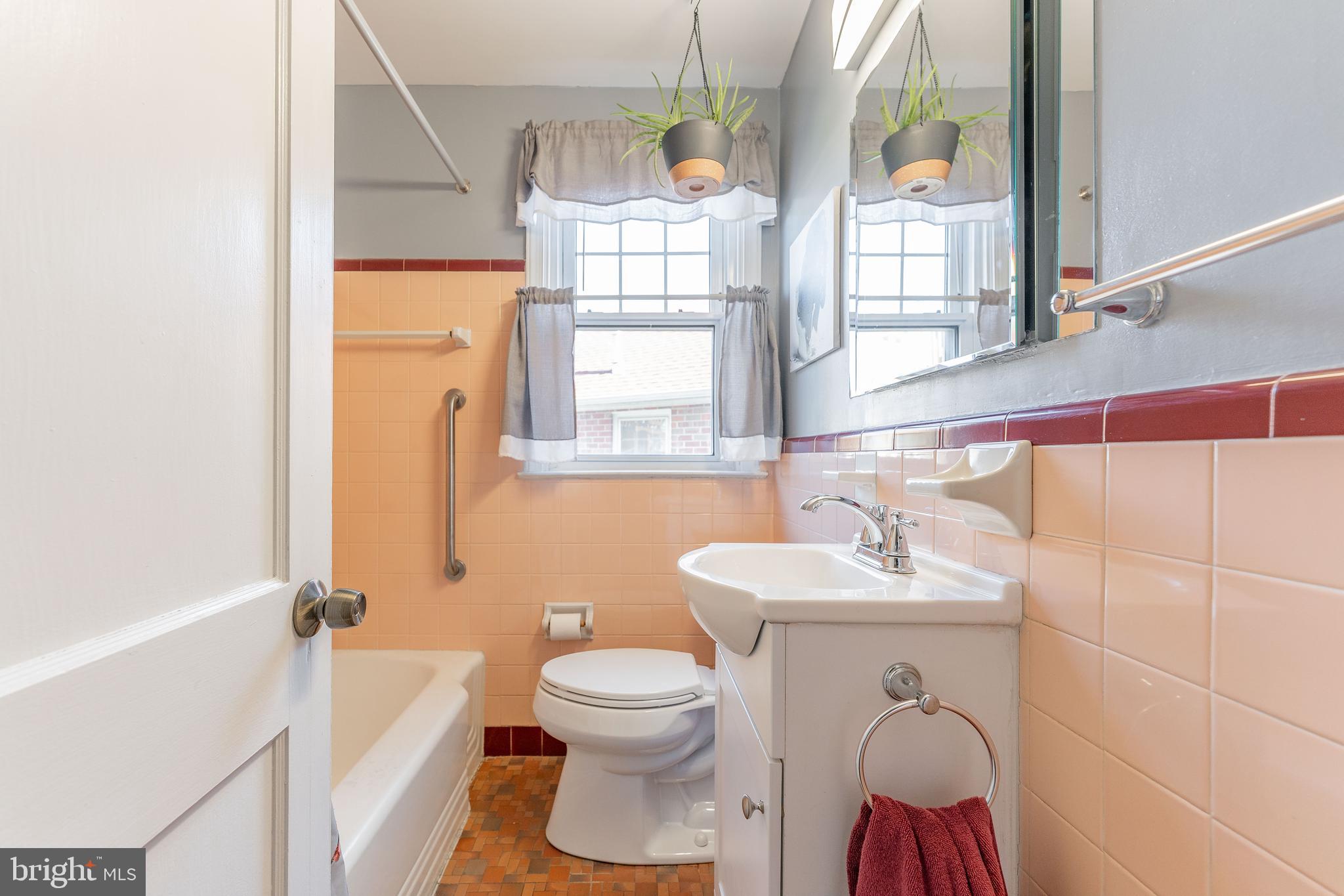 501 W Road Ridley Park, PA 19078 - Photo 17 of 29 a bathroom with a sink toilet mirror and tub