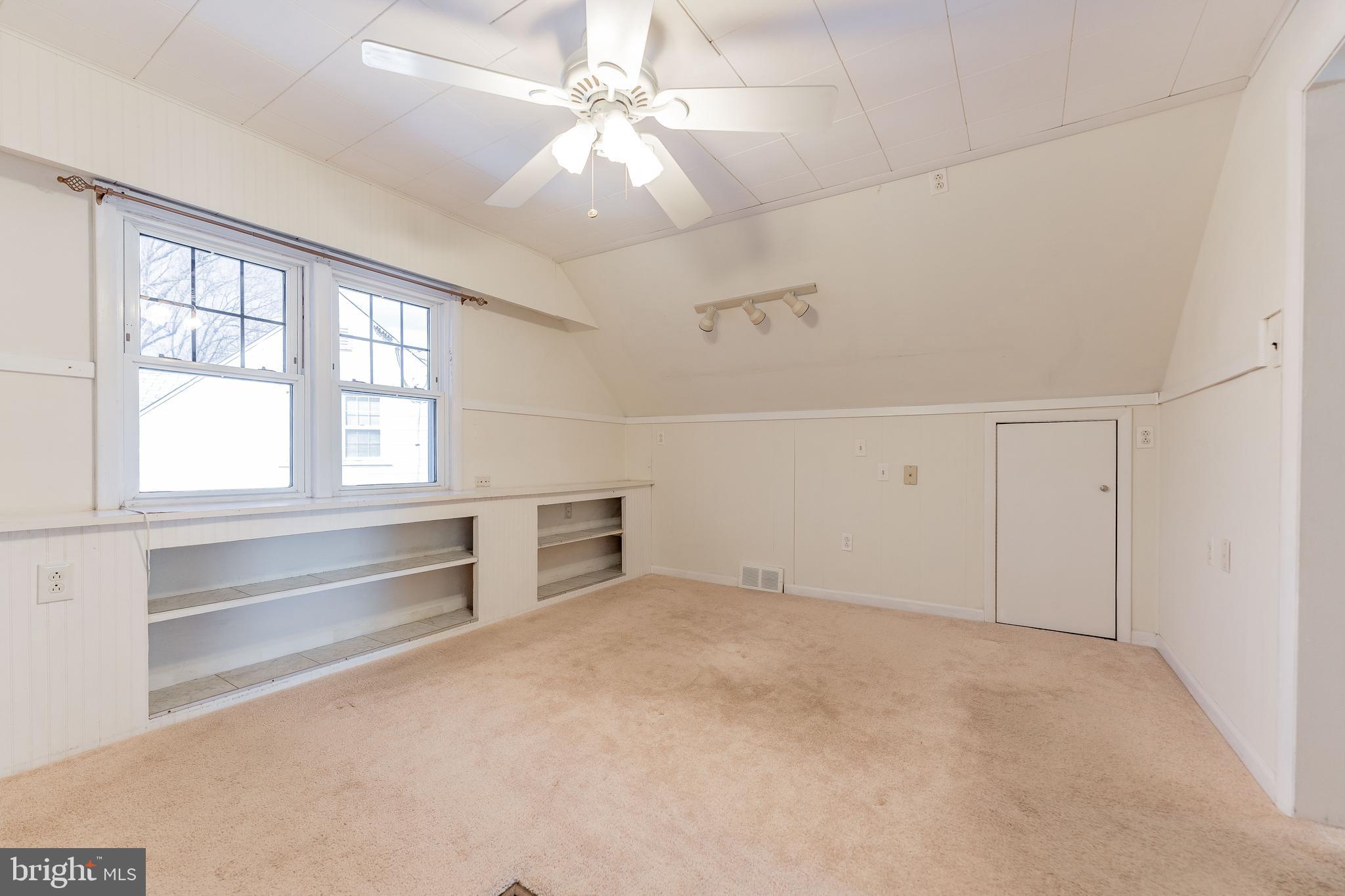 501 W Road Ridley Park, PA 19078 - Photo 18 of 29 an empty room with windows and fan