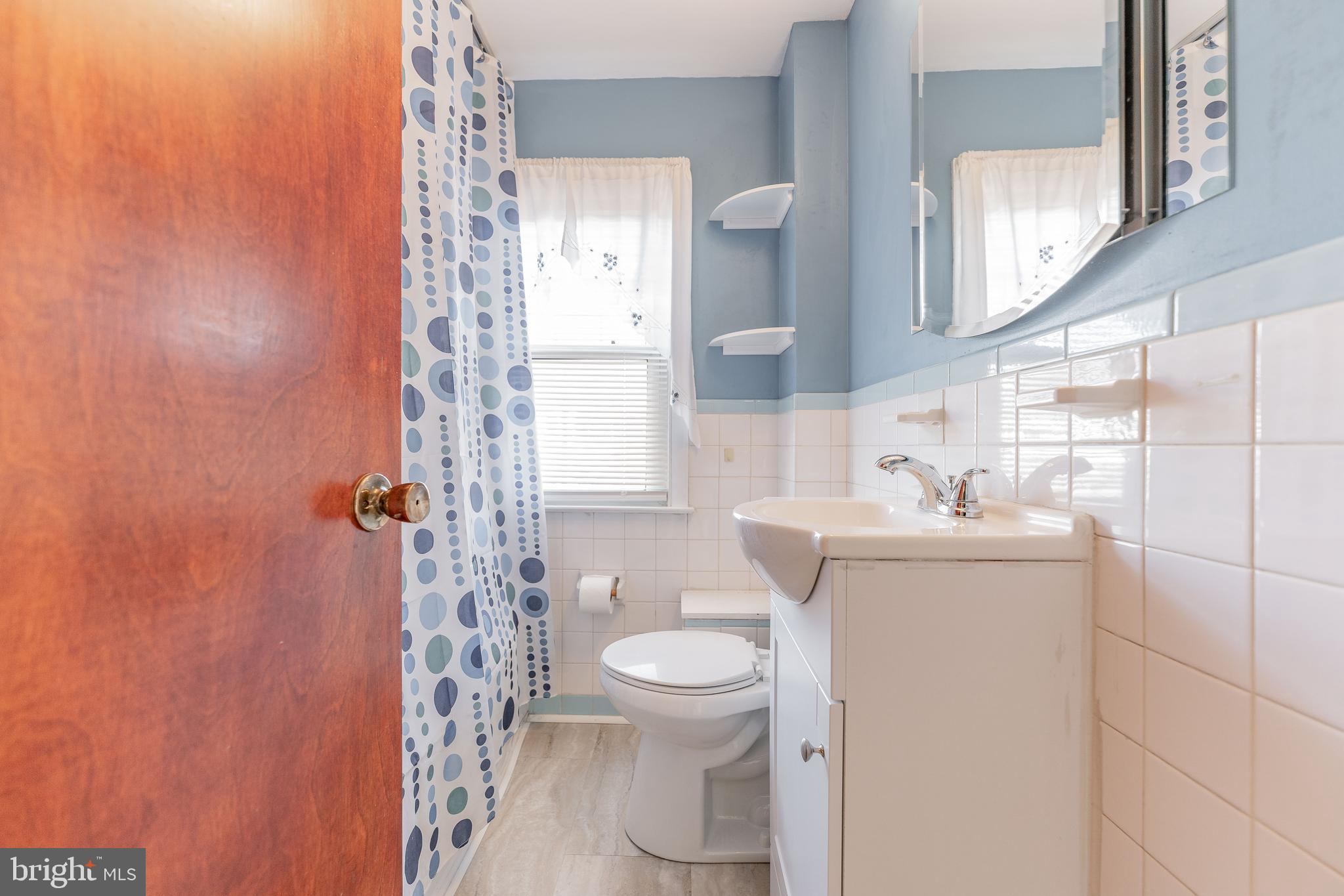 501 W Road Ridley Park, PA 19078 - Photo 24 of 29 a bathroom with a toilet a sink and a mirror