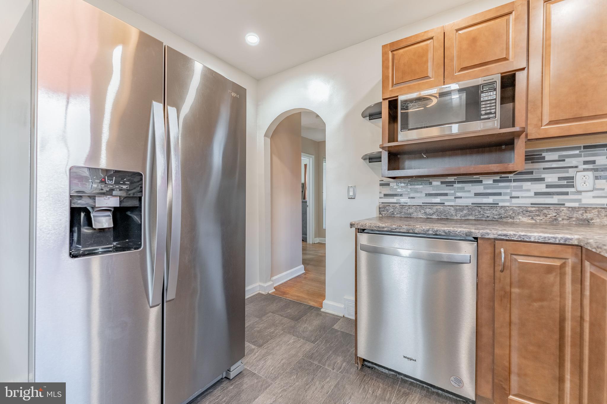 501 W Road Ridley Park, PA 19078 - Photo 9 of 29 a kitchen with stainless steel appliances granite countertop a refrigerator and a stove top oven