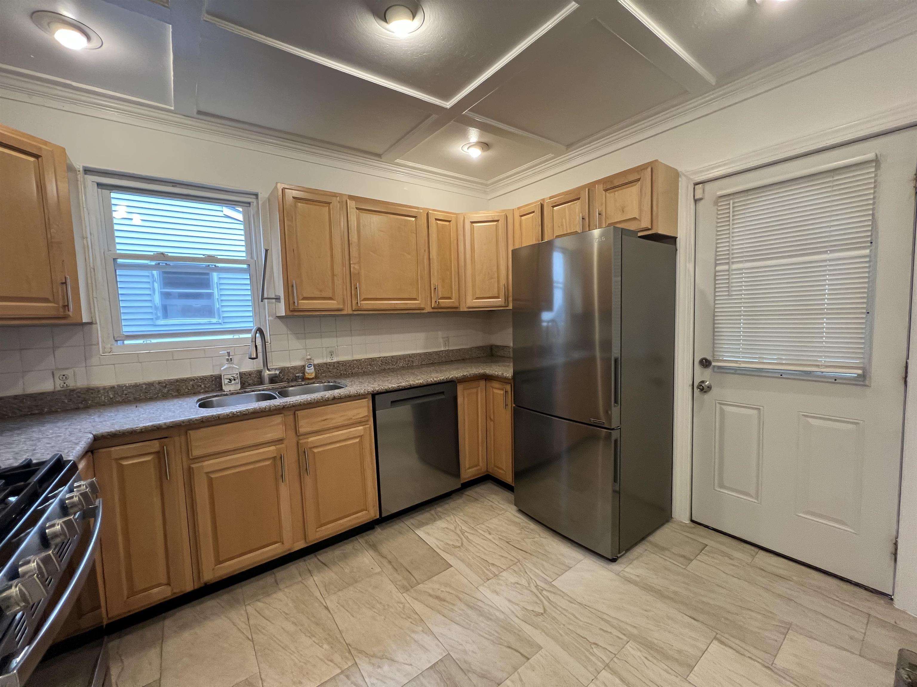 1 8th Street Ridgefield Park, NJ 07660 - Photo 13 of 27 a kitchen with stainless steel appliances granite countertop a refrigerator and a sink