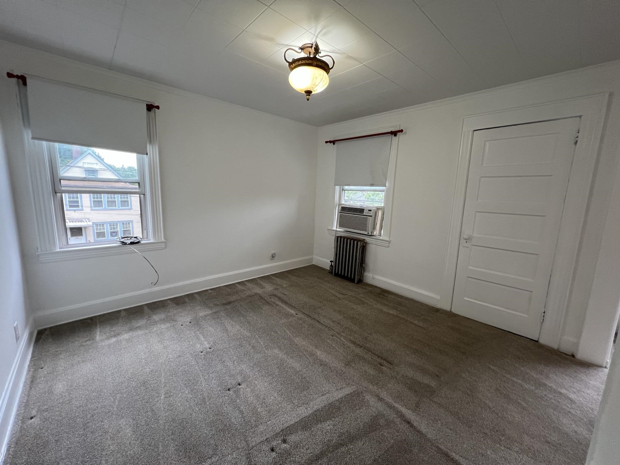 1 8th Street Ridgefield Park, NJ 07660 - Photo 15 of 27 wooden floor in an empty room with a window
