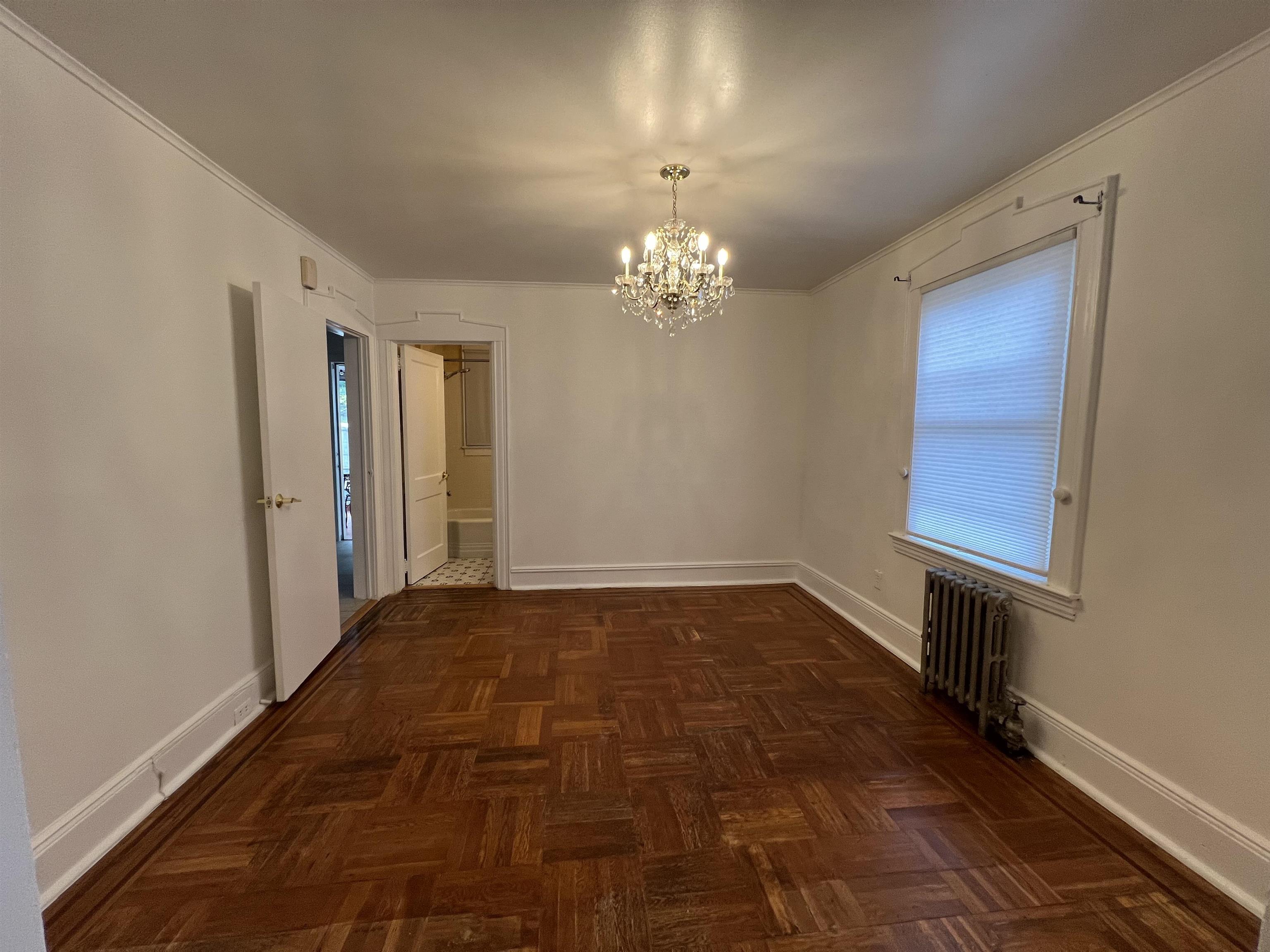 1 8th Street Ridgefield Park, NJ 07660 - Photo 10 of 27 a view of a room with wooden floor and chandelier