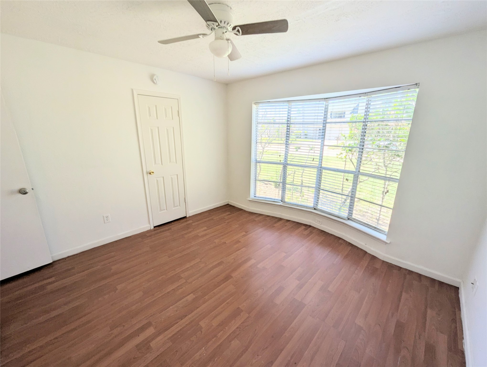 17602 Crestline Road Humble, TX 77396 - Photo 17 of 27 an empty room with wooden floor and windows