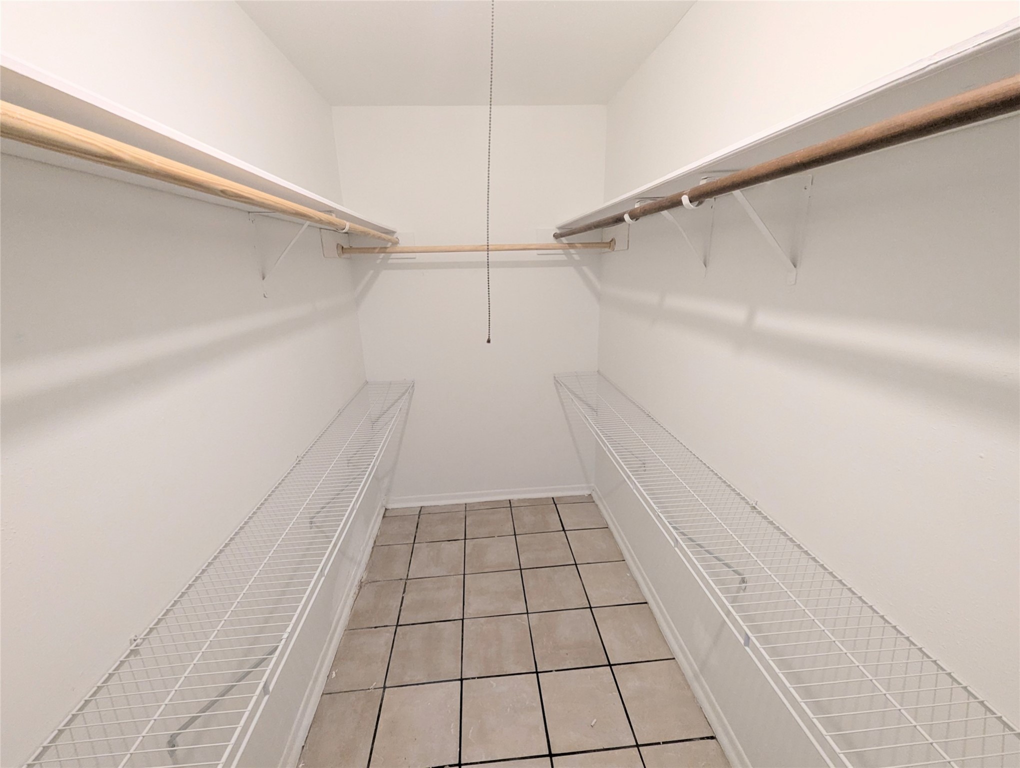 17602 Crestline Road Humble, TX 77396 - Photo 22 of 27 a view of a closet and wooden floor