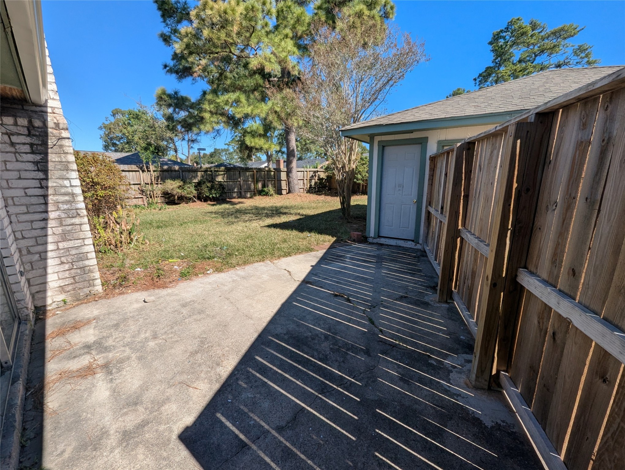 17602 Crestline Road Humble, TX 77396 - Photo 25 of 27 a view of a backyard with wooden fence