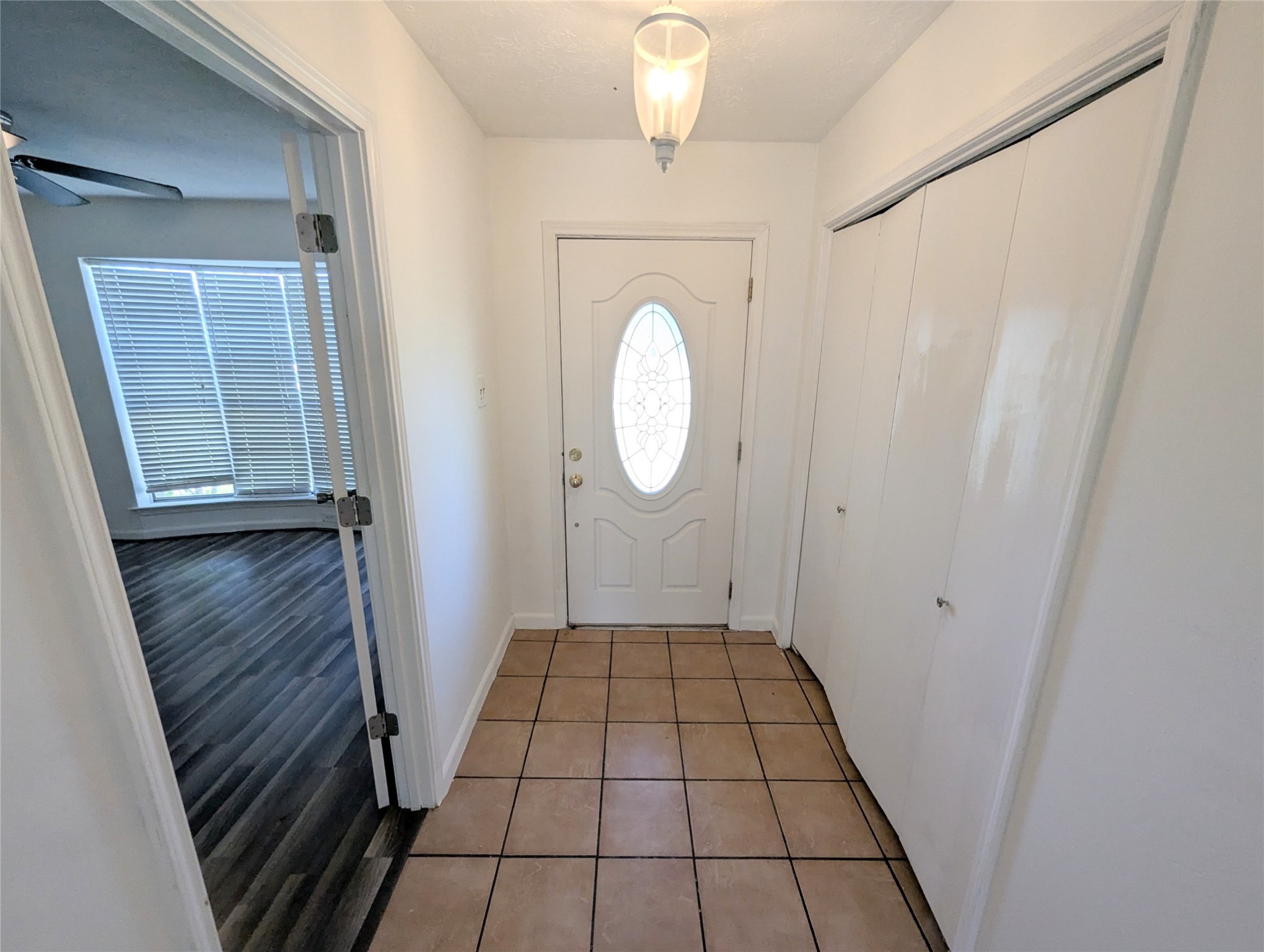 17602 Crestline Road Humble, TX 77396 - Photo 4 of 27 a view of a hallway in a house with wooden floor