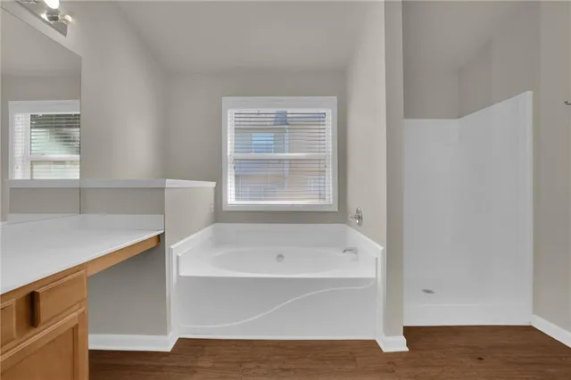 a white bath tub sitting next to a window