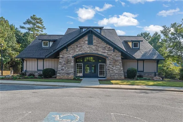an aerial view of a houses with a lake view