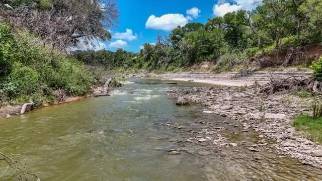 a view of a road with a yard