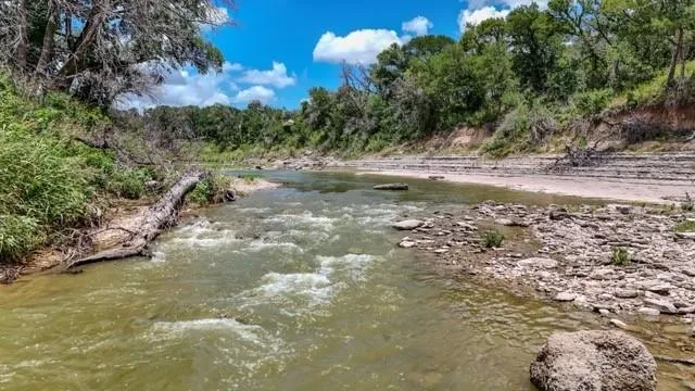 a view of a road with a yard