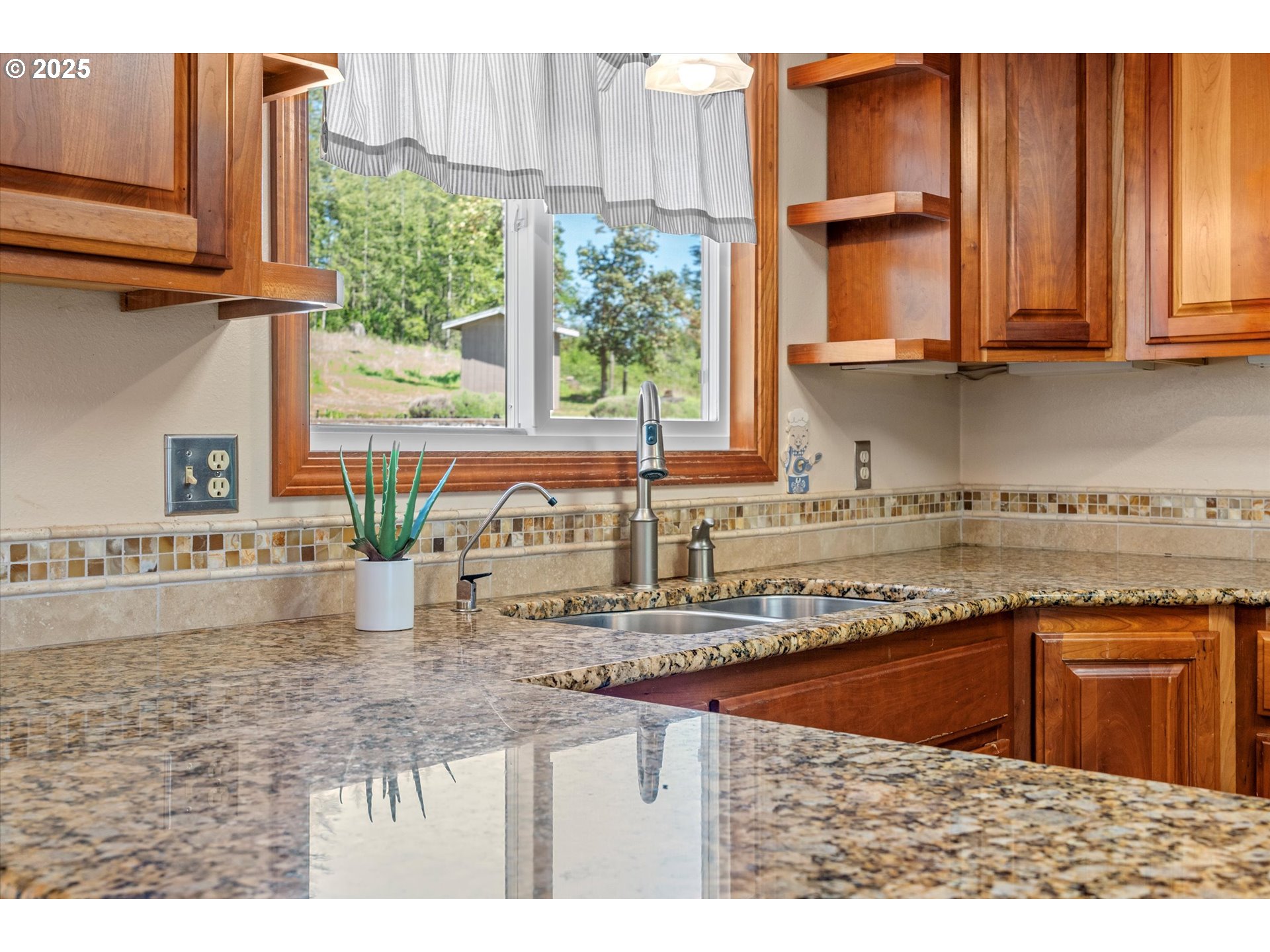 32117 Bellinger Scale Road Lebanon, OR 97355 - Photo 15 of 40 a kitchen with stainless steel appliances granite countertop a sink a stove and a microwave