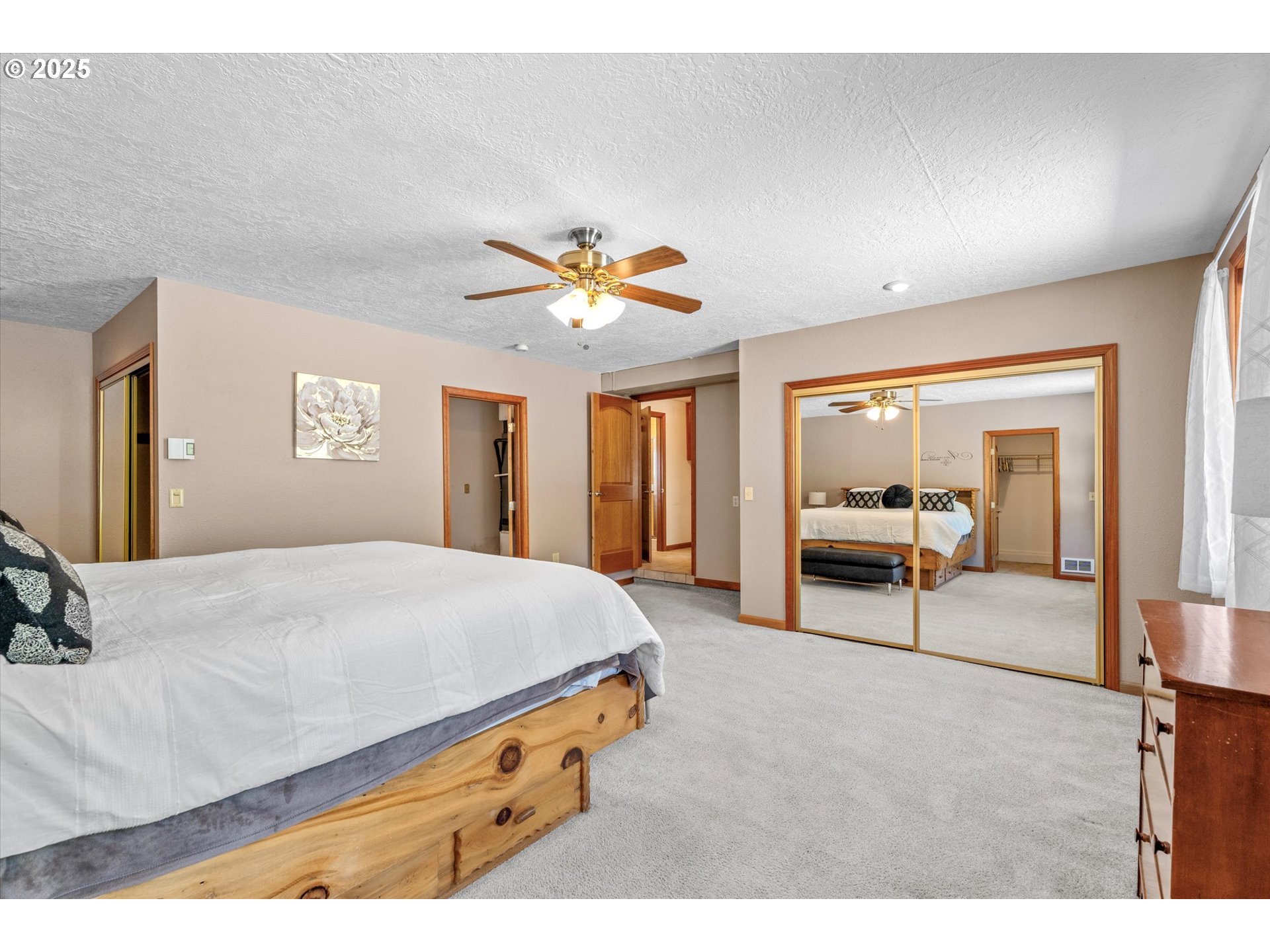 32117 Bellinger Scale Road Lebanon, OR 97355 - Photo 22 of 40 a bedroom with a bed and a chandelier