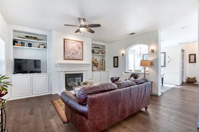 a living room with furniture fireplace and a flat screen tv