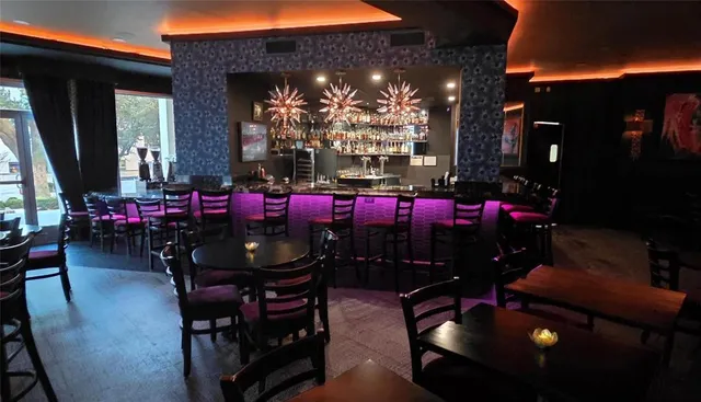 a view of a tables and chairs in patio