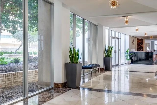 a front view of a building with trees