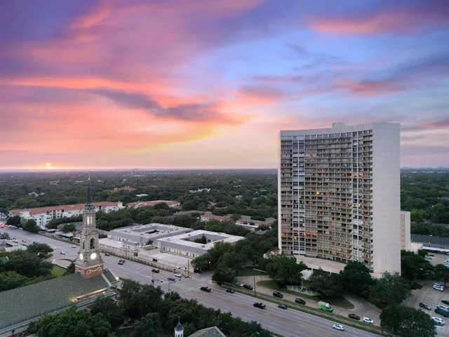 a living room with furniture and a kitchen
