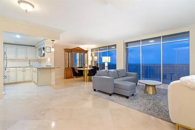 a view of a room with a table and chairs