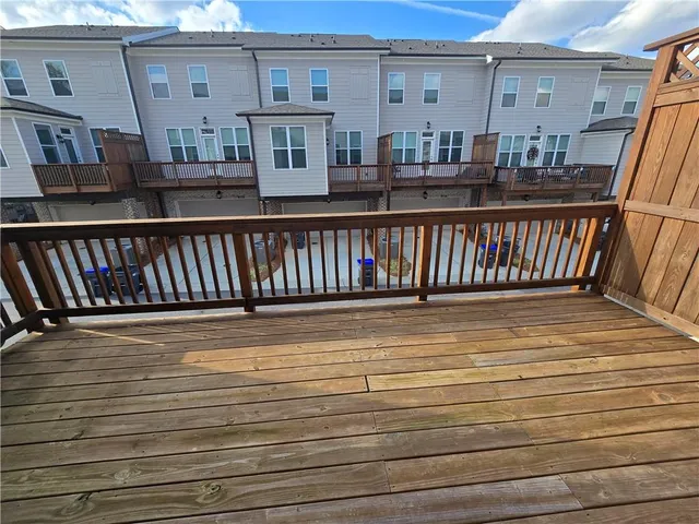 a view of a balcony with wooden floor
