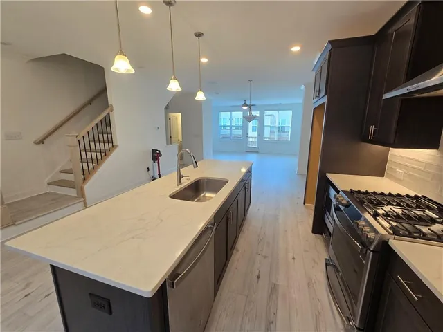 a kitchen with sink and stove