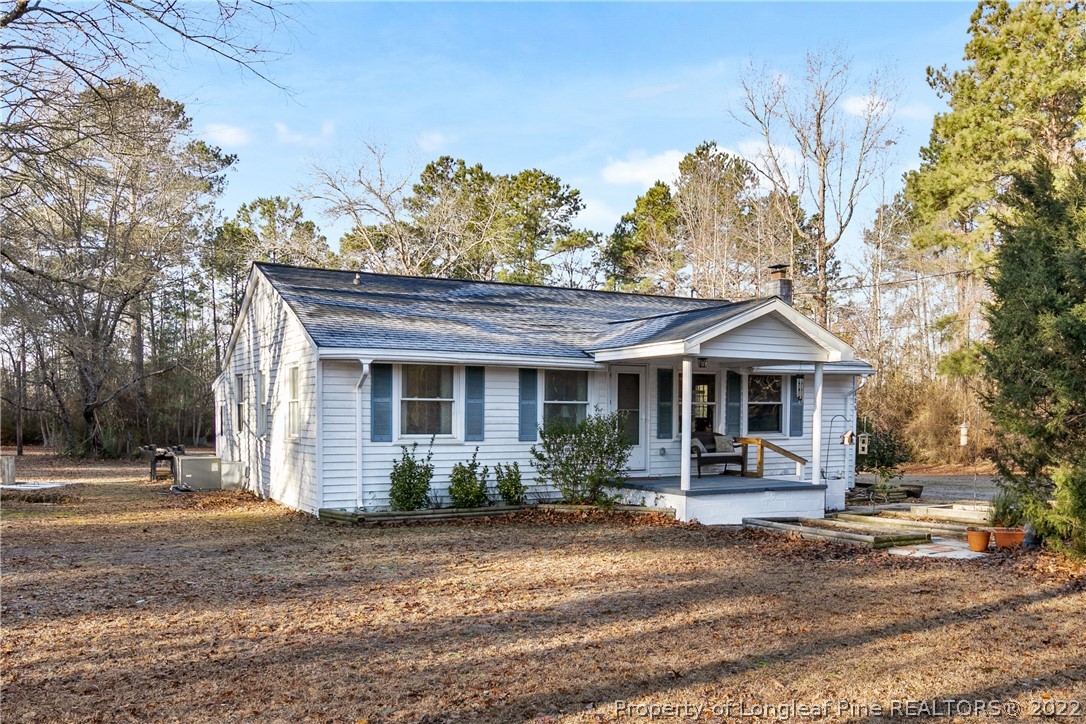 628 Tc Jones Road Raeford, NC 28376 - Photo 1 of 46 a front view of a house with garden