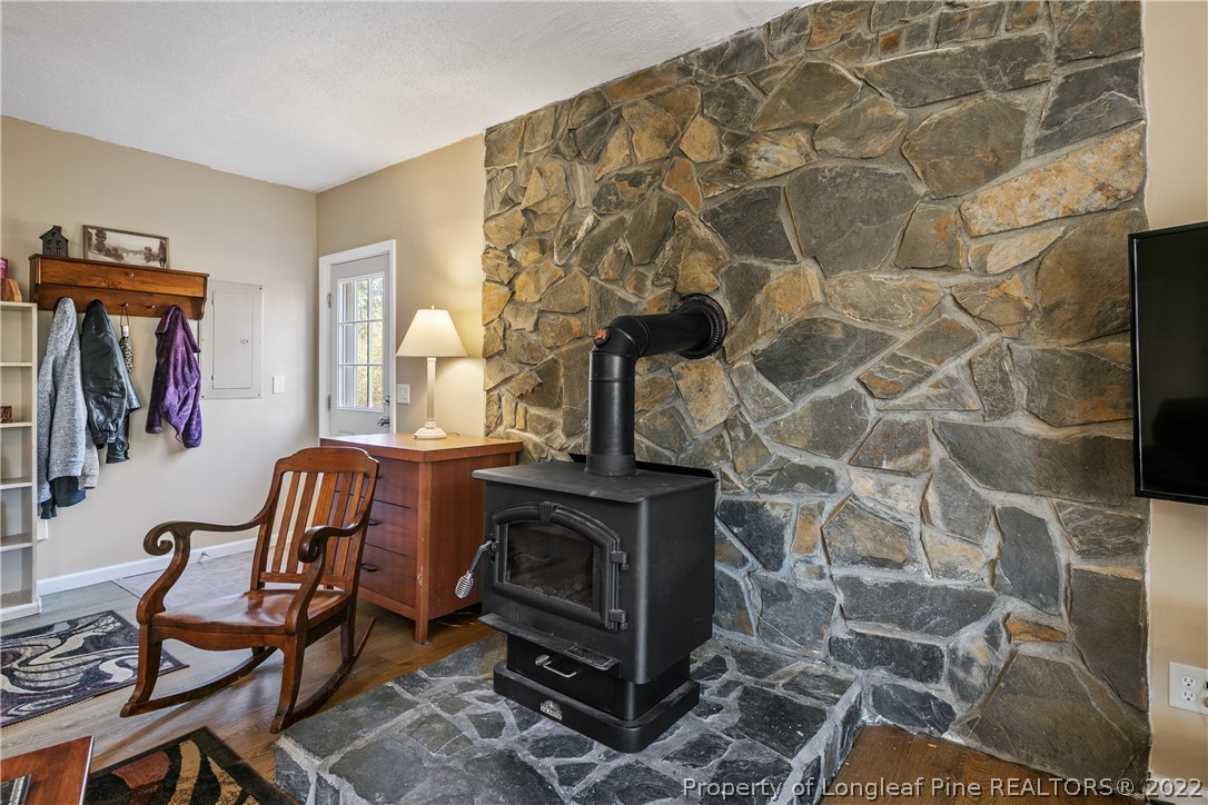 628 Tc Jones Road Raeford, NC 28376 - Photo 12 of 46 a living room with furniture and a fireplace