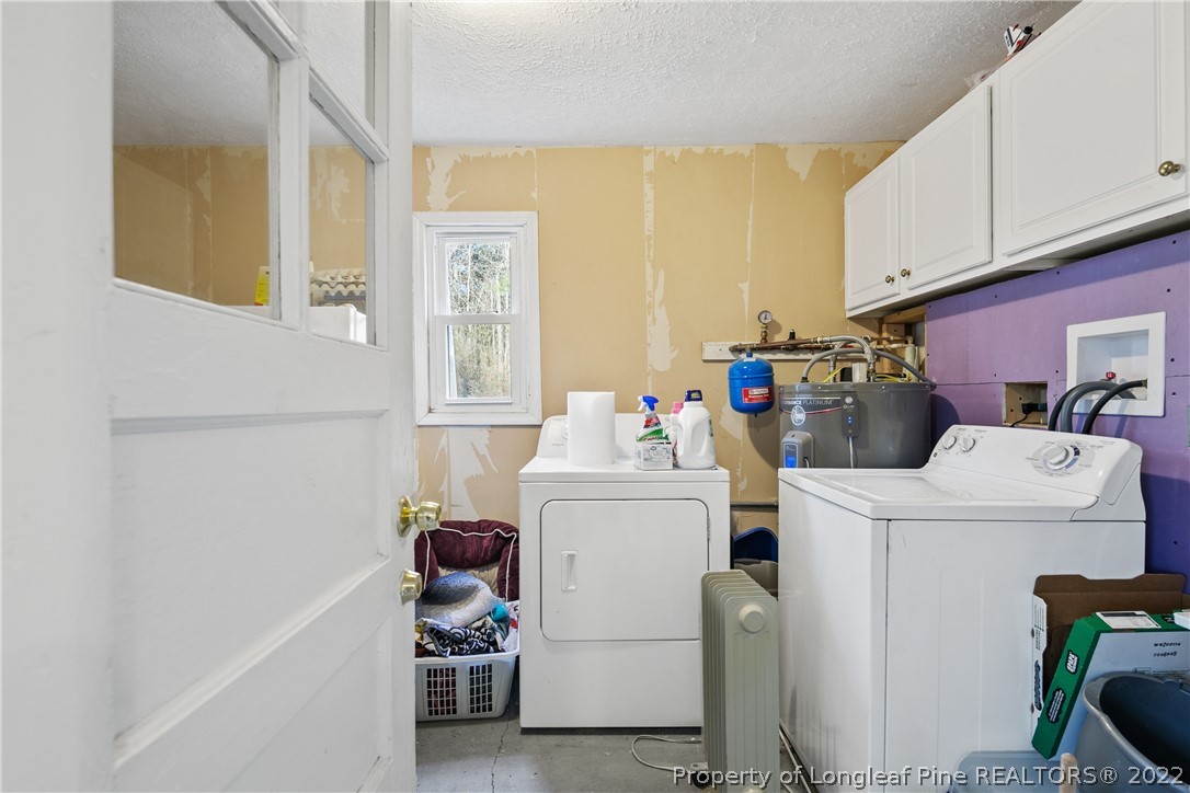 628 Tc Jones Road Raeford, NC 28376 - Photo 24 of 46 a utility room with dryer and washer