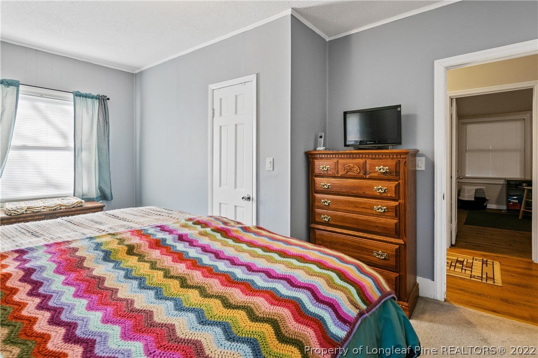628 Tc Jones Road Raeford, NC 28376 - Photo 26 of 46 a bedroom with a bed and a television