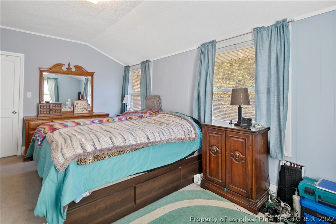 628 Tc Jones Road Raeford, NC 28376 - Photo 28 of 46 a bedroom with a bed and a window