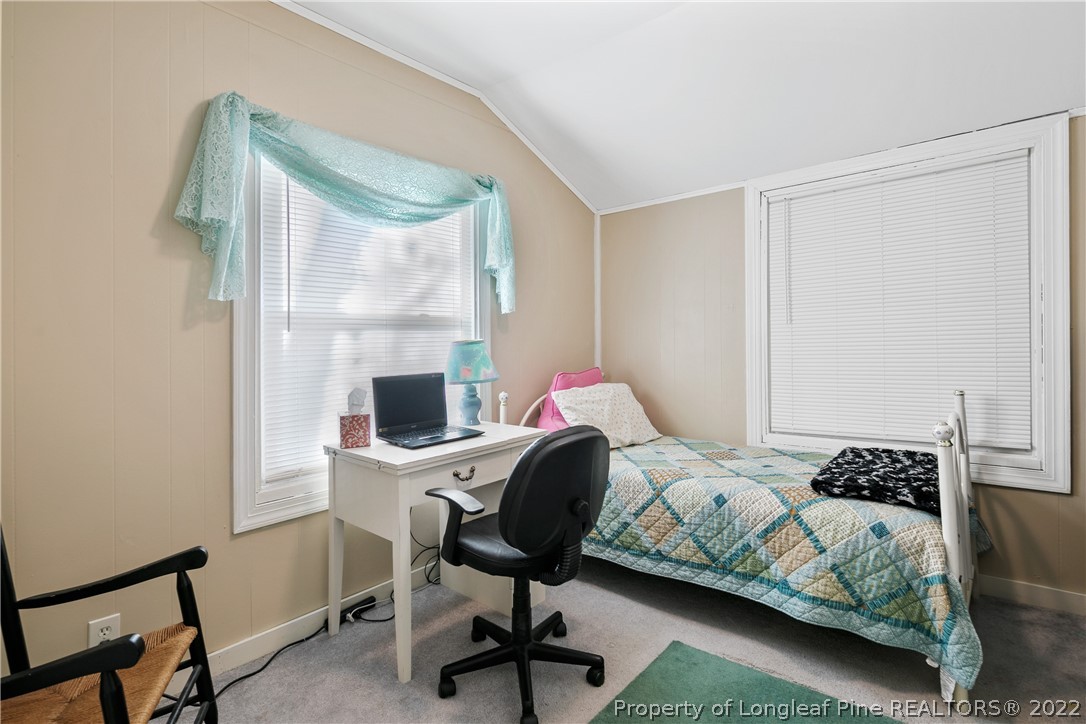 628 Tc Jones Road Raeford, NC 28376 - Photo 29 of 46 a bedroom with a bed chair and a window