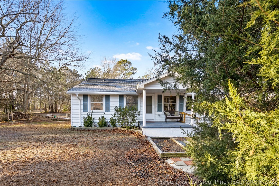 628 Tc Jones Road Raeford, NC 28376 - Photo 3 of 46 a front view of a house with garden