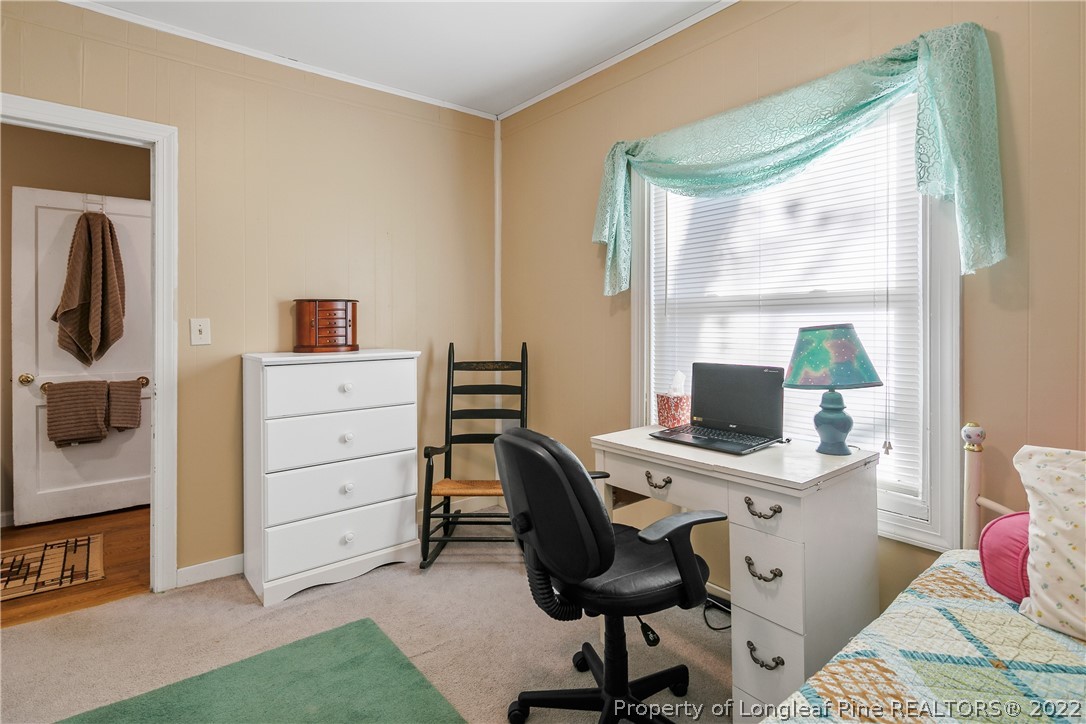 628 Tc Jones Road Raeford, NC 28376 - Photo 31 of 46 a view of a workspace with furniture and a window