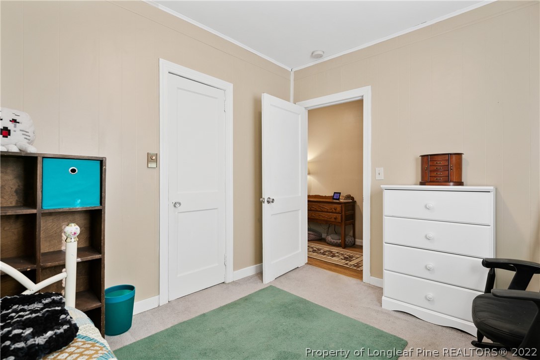 628 Tc Jones Road Raeford, NC 28376 - Photo 32 of 46 a view of a bedroom with furniture and closet