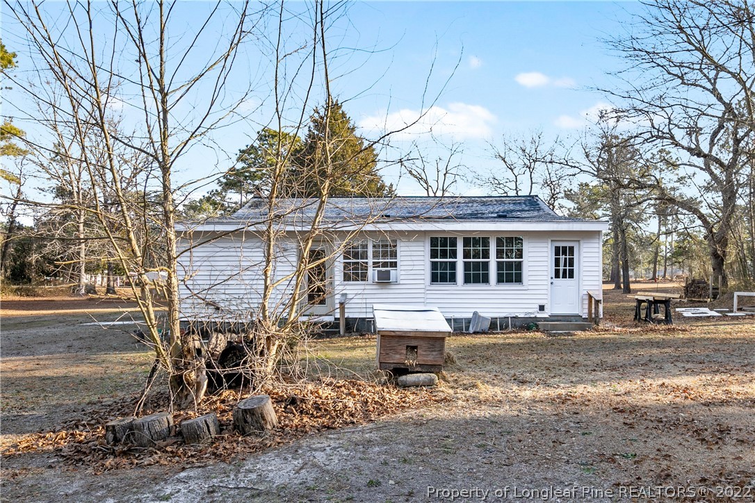 628 Tc Jones Road Raeford, NC 28376 - Photo 39 of 46 a view of a house with a yard patio and fire pit