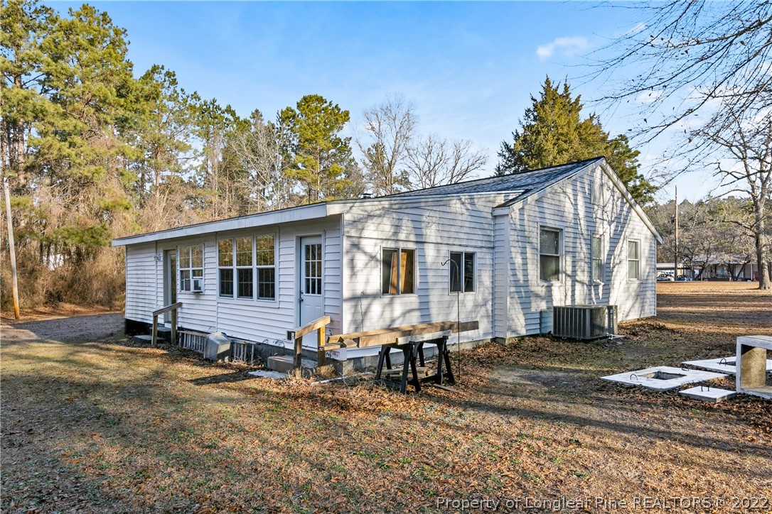 628 Tc Jones Road Raeford, NC 28376 - Photo 40 of 46 a front view of a house with garden