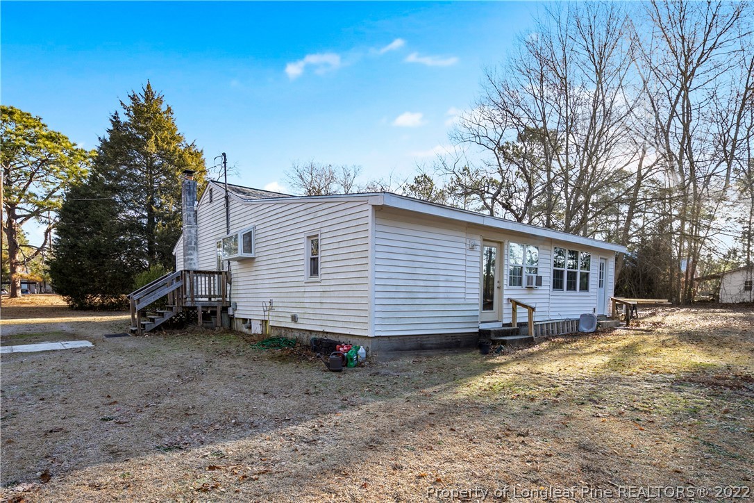628 Tc Jones Road Raeford, NC 28376 - Photo 41 of 46 a view of a house with a yard